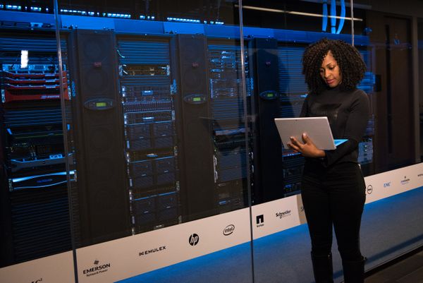 IT professional in server room representing biometric security careers